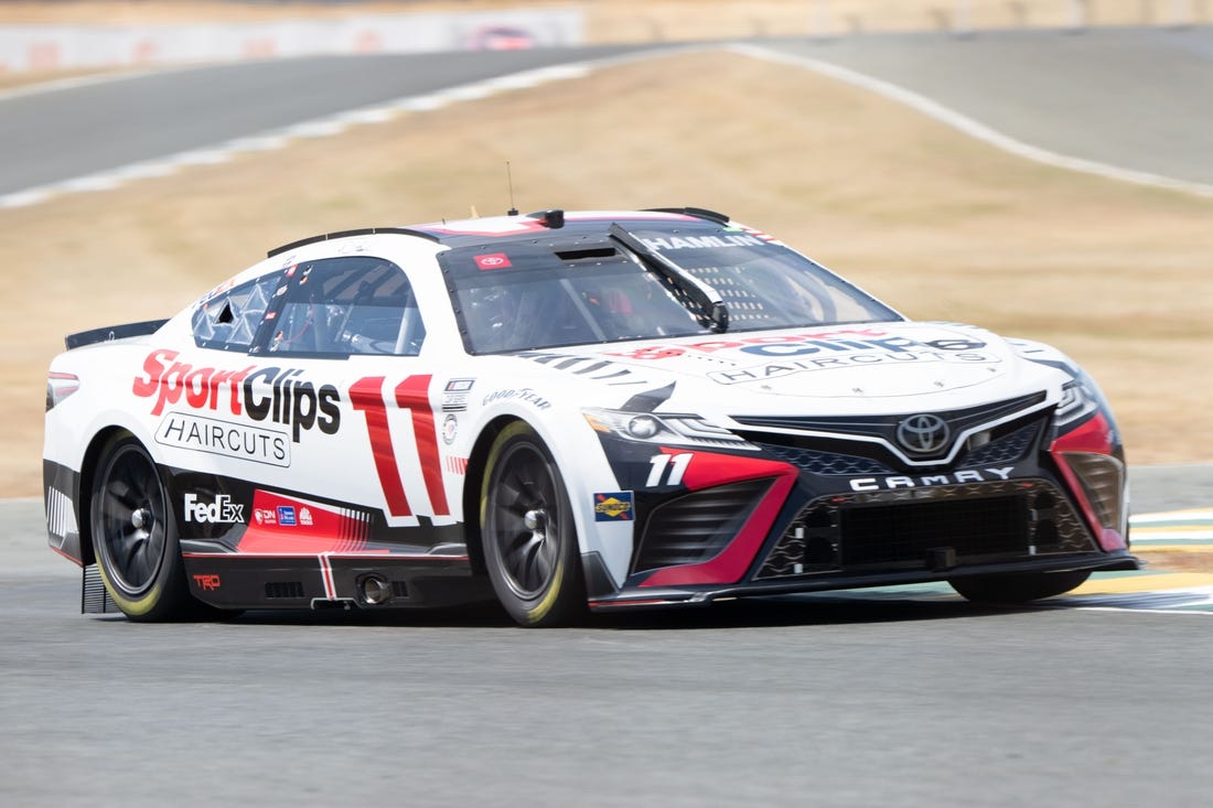 Jun 10, 2023; Sonoma, California, USA; NASCAR Cup Series driver Denny Hamlin (11) performs a practice lap before qualifications at Sonoma Raceway. Mandatory Credit: Stan Szeto-USA TODAY Sports