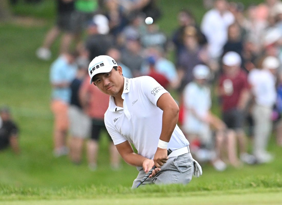 Jun 10, 2023; Toronto, ON, CAN;  C.T. Pan chips onto the green on the 18th hole during the third round of the RBC Canadian Open golf tournament. Mandatory Credit: Dan Hamilton-USA TODAY Sports