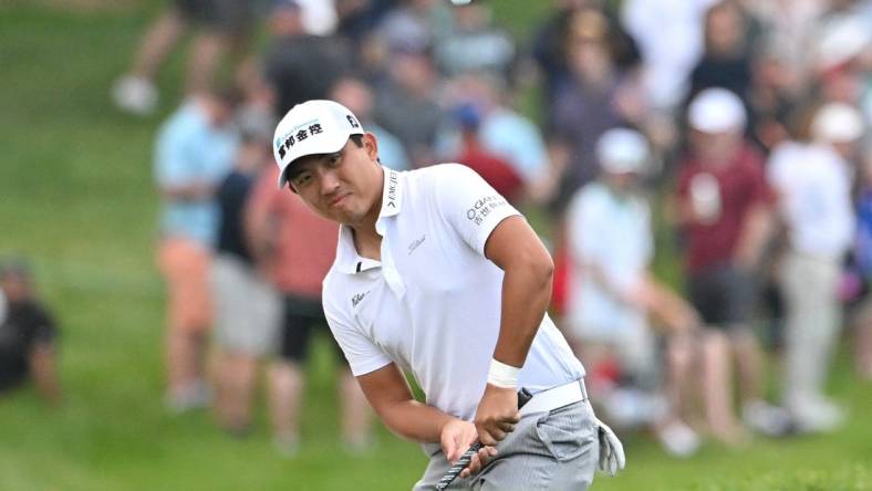 Jun 10, 2023; Toronto, ON, CAN;  C.T. Pan chips onto the green on the 18th hole during the third round of the RBC Canadian Open golf tournament. Mandatory Credit: Dan Hamilton-USA TODAY Sports