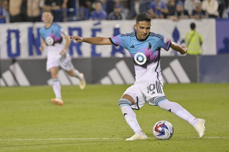 Jun 10, 2023; Montreal, Quebec, CAN; Minnesota United midfielder Emanuel Reynoso (10) plays the ball in the second half against the CF Montreal at Stade Saputo. Mandatory Credit: Eric Bolte-USA TODAY Sports