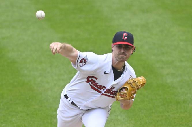 Cleveland Guardians pitcher Shane Bieber (57) pitches the ball