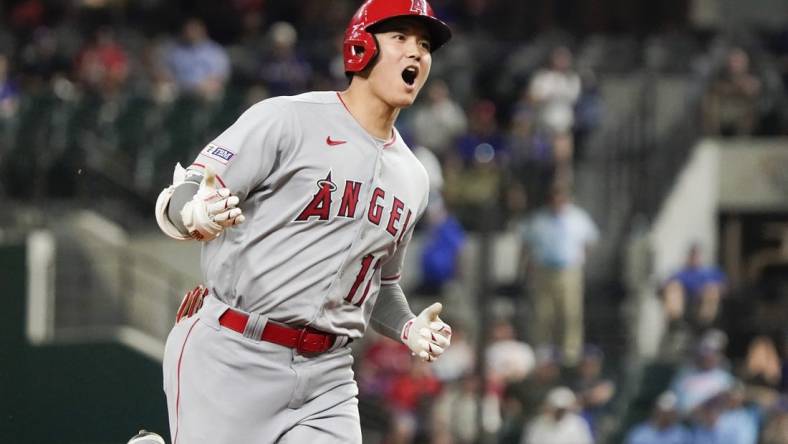 Jun 12, 2023; Arlington, Texas, USA; Los Angeles Angels designated hitter Shohei Ohtani (17) reacts as he rounds the bases after hitting a two run go ahead home run during the twelfth inning against the Texas Rangers at Globe Life Field. Mandatory Credit: Raymond Carlin III-USA TODAY Sports