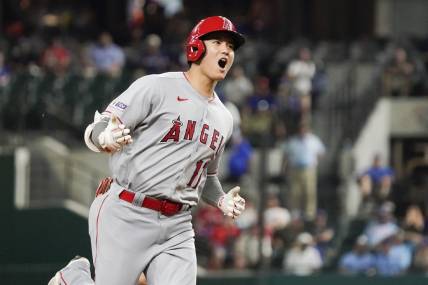 Jun 12, 2023; Arlington, Texas, USA; Los Angeles Angels designated hitter Shohei Ohtani (17) reacts as he rounds the bases after hitting a two run go ahead home run during the twelfth inning against the Texas Rangers at Globe Life Field. Mandatory Credit: Raymond Carlin III-USA TODAY Sports
