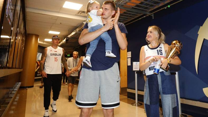 Jun 12, 2023; Denver, Colorado, USA; Denver Nuggets center Nikola Jokic (15) celebrates with his family after the Nuggets won the NBA championship by defeating the Miami Heat in game five of the 2023 NBA Finals at Ball Arena. Mandatory Credit: Isaiah J. Downing-USA TODAY Sports