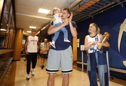 Jun 12, 2023; Denver, Colorado, USA; Denver Nuggets center Nikola Jokic (15) celebrates with his family after the Nuggets won the NBA championship by defeating the Miami Heat in game five of the 2023 NBA Finals at Ball Arena. Mandatory Credit: Isaiah J. Downing-USA TODAY Sports