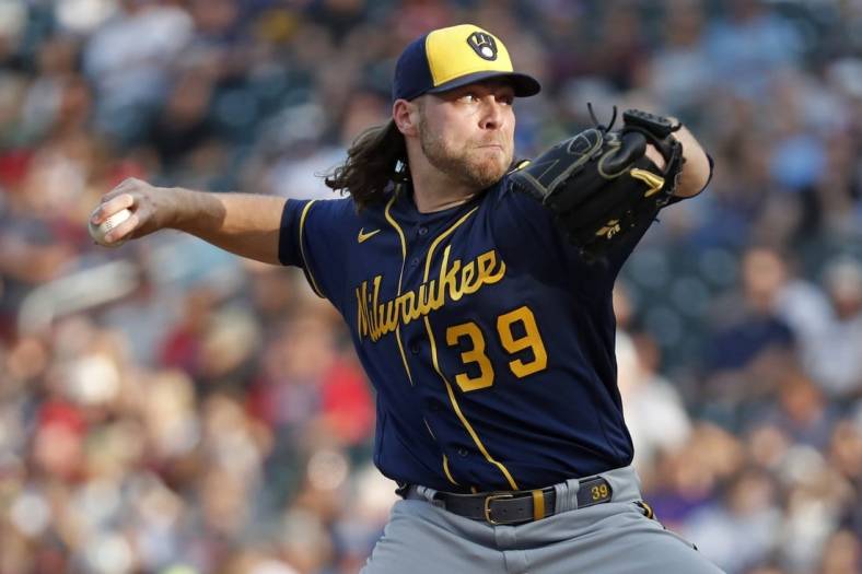 Burnes delivers with arm, bat as Brewers trounce Cubs 7-0