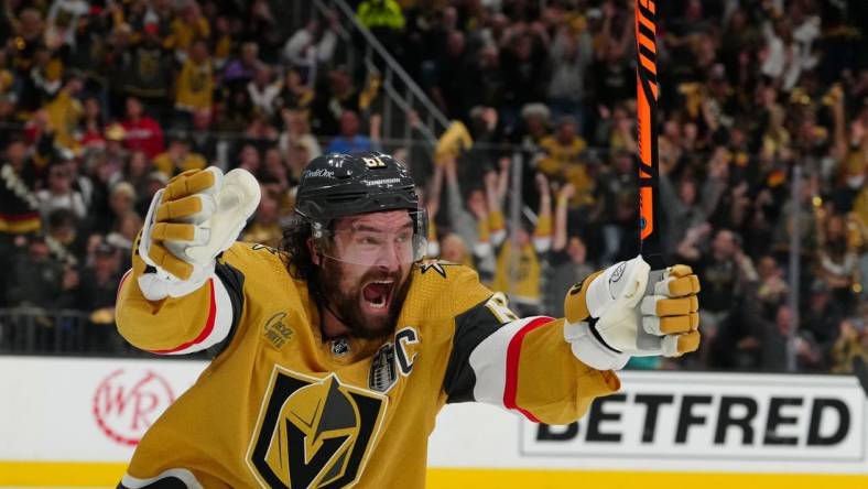 Jun 13, 2023; Las Vegas, Nevada, USA; Vegas Golden Knights forward Reilly Smith (19) celebrates his goal against the Florida Panthers during the second period in game five of the 2023 Stanley Cup Final at T-Mobile Arena. Mandatory Credit: Stephen R. Sylvanie-USA TODAY Sports