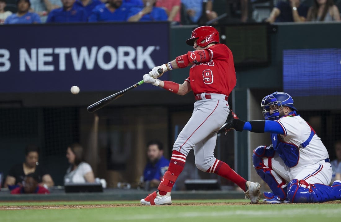 Jun 13, 2023; Arlington, Texas, USA;  Los Angeles Angels shortstop Zach Neto (9) hits a two-run home run during the ninth inning against the Texas Rangers at Globe Life Field. Mandatory Credit: Kevin Jairaj-USA TODAY Sports