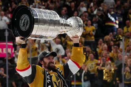 Jun 13, 2023; Las Vegas, Nevada, USA; Vegas Golden Knights forward Mark Stone (61) hoists the Stanley Cup after defeating the Florida Panthers in game five of the 2023 Stanley Cup Final at T-Mobile Arena. Mandatory Credit: Stephen R. Sylvanie-USA TODAY Sports