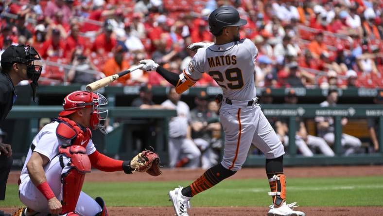 Jun 14, 2023; St. Louis, Missouri, USA;  San Francisco Giants center fielder Luis Matos (29) hits a single in his Major League debut against the St. Louis Cardinals during the first inning at Busch Stadium. Mandatory Credit: Jeff Curry-USA TODAY Sports