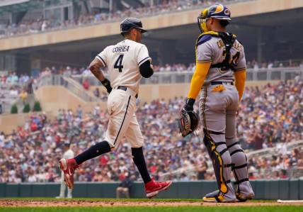 Jun 14, 2023; Minneapolis, Minnesota, USA; Minnesota Twins shortstop Carlos Correa (4) scores against the Milwaukee Brewers in the third inning at Target Field. Mandatory Credit: Brad Rempel-USA TODAY Sports