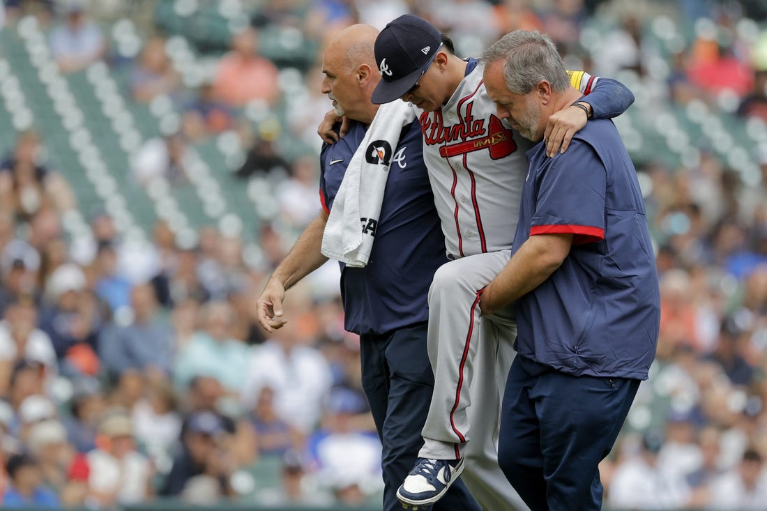Jun 14, 2023; Detroit, Michigan, USA;  Atlanta Braves relief pitcher Jesse Chavez (60) is helped off the field after he is hit by a batted ball in the sixth inning against the Detroit Tigers at Comerica Park. Mandatory Credit: Rick Osentoski-USA TODAY Sports