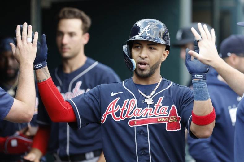 Eddie Rosario of the Atlanta Braves celebrates after hitting a home in  2023