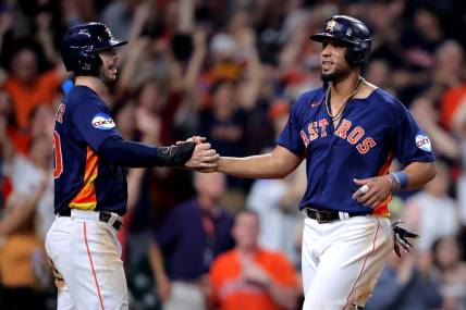 Jun 14, 2023; Houston, Texas, USA; Houston Astros first baseman Jose Abreu (79) is congratulated by Houston Astros right fielder Kyle Tucker (30) after crossing home plate for the winning run on a throwing error against the Washington Nationals during the ninth inning at Minute Maid Park. Mandatory Credit: Erik Williams-USA TODAY Sports