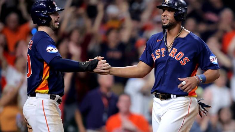 Jun 14, 2023; Houston, Texas, USA; Houston Astros first baseman Jose Abreu (79) is congratulated by Houston Astros right fielder Kyle Tucker (30) after crossing home plate for the winning run on a throwing error against the Washington Nationals during the ninth inning at Minute Maid Park. Mandatory Credit: Erik Williams-USA TODAY Sports