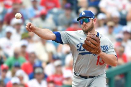 Jun 11, 2023; Philadelphia, Pennsylvania, USA; Los Angeles Dodgers third baseman Max Muncy (13) throws to first base against the Philadelphia Phillies at Citizens Bank Park. Mandatory Credit: Eric Hartline-USA TODAY Sports