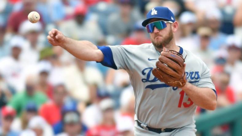 Jun 11, 2023; Philadelphia, Pennsylvania, USA; Los Angeles Dodgers third baseman Max Muncy (13) throws to first base against the Philadelphia Phillies at Citizens Bank Park. Mandatory Credit: Eric Hartline-USA TODAY Sports