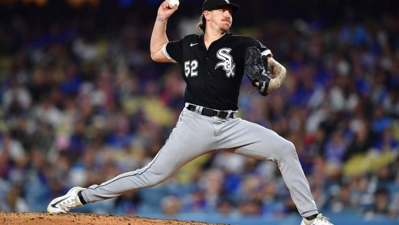 Jun 14, 2023; Los Angeles, California, USA; Chicago White Sox starting pitcher Mike Clevinger (52) throws against the Los Angeles Dodgers during the fourth inning at Dodger Stadium. Mandatory Credit: Gary A. Vasquez-USA TODAY Sports