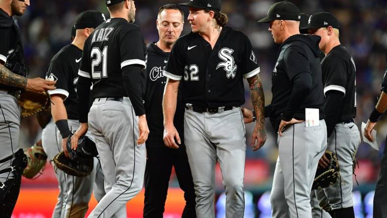 Jun 14, 2023; Los Angeles, California, USA; Chicago White Sox starting pitcher Mike Clevinger (52) reacts after suffering an apparent injury against the Los Angeles Dodgers/ during the fifth inning at Dodger Stadium. Mandatory Credit: Gary A. Vasquez-USA TODAY Sports