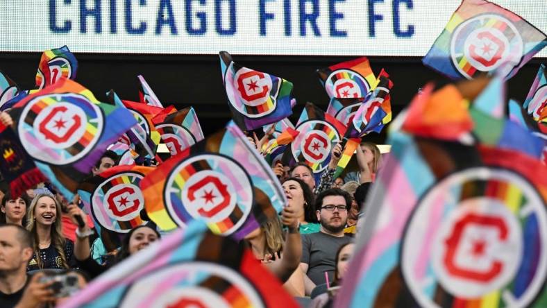 June 10, 2023; Chicago, Illinois, USA;  Fans wave Pride flags before a match between the Chicago Fire FC and the Columbus Crew SC at Soldier Field. Mandatory Credit: Jamie Sabau-USA TODAY Sports