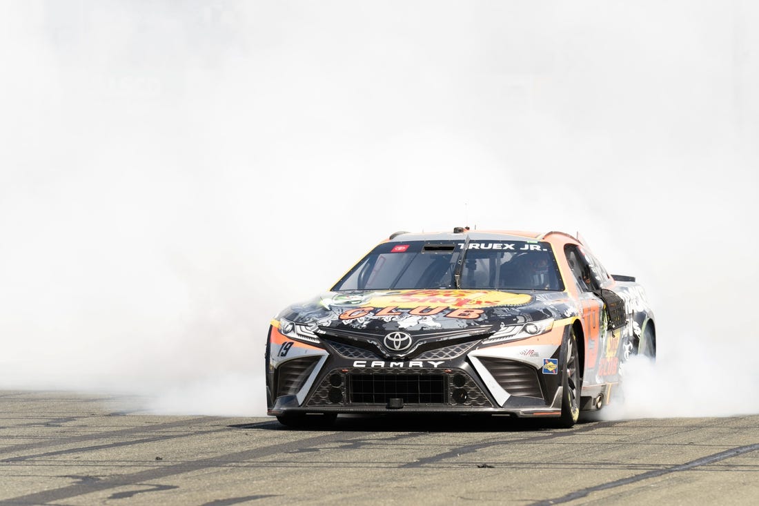 Jun 11, 2023; Sonoma, California, USA;  NASCAR Cup Series driver Martin Truex Jr. (19) celebrates after winning the Toyota / Save Mart 350 at Sonoma Raceway. Mandatory Credit: Stan Szeto-USA TODAY Sports