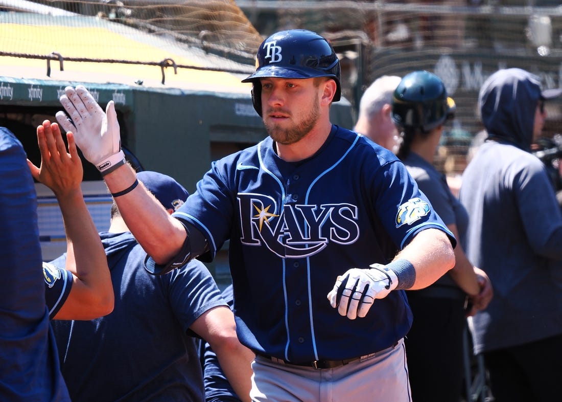 Jun 15, 2023; Oakland, California, USA; Tampa Bay Rays first baseman Luke Raley (55) high fives teammates after hitting a solo home run against the Oakland Athletics during the eighth inning at Oakland-Alameda County Coliseum. Mandatory Credit: Kelley L Cox-USA TODAY Sports