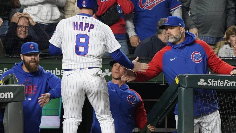 Jun 15, 2023; Chicago, Illinois, USA; Chicago Cubs left fielder Ian Happ (8) celebrates with manager David Ross (3) after scoring against the Pittsburgh Pirates during the fifth inning at Wrigley Field. Mandatory Credit: David Banks-USA TODAY Sports