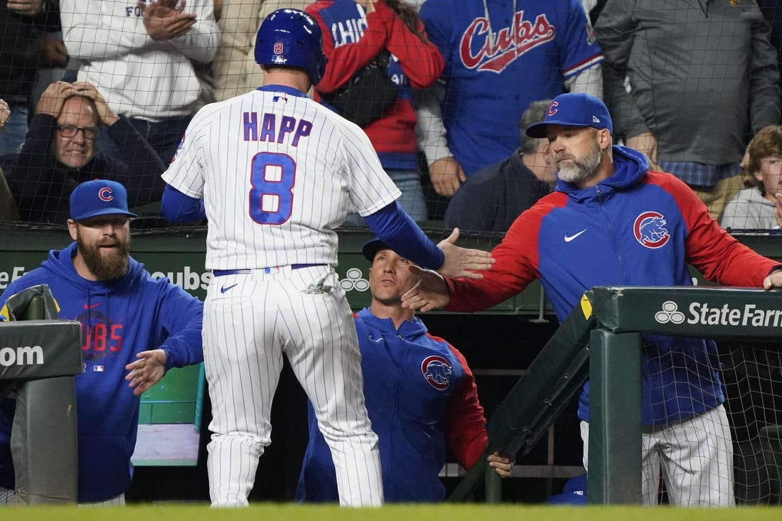 Jun 15, 2023; Chicago, Illinois, USA; Chicago Cubs left fielder Ian Happ (8) celebrates with manager David Ross (3) after scoring against the Pittsburgh Pirates during the fifth inning at Wrigley Field. Mandatory Credit: David Banks-USA TODAY Sports