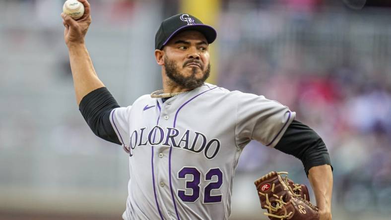 Jun 16, 2023; Cumberland, Georgia, USA; Colorado Rockies starting pitcher Dinelson Lamet (32) pitches against the Atlanta Braves during the first inning at Truist Park. Mandatory Credit: Dale Zanine-USA TODAY Sports