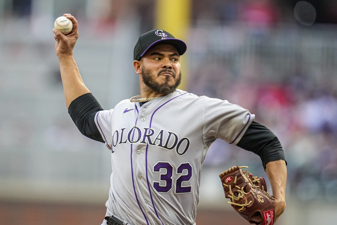 Jun 16, 2023; Cumberland, Georgia, USA; Colorado Rockies starting pitcher Dinelson Lamet (32) pitches against the Atlanta Braves during the first inning at Truist Park. Mandatory Credit: Dale Zanine-USA TODAY Sports