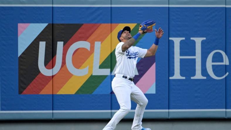 Jun 16, 2023; Los Angeles, California, USA;   Los Angeles Dodgers left fielder David Peralta (6) makes a catch for an out in the first inning against the San Francisco Giants at Dodger Stadium. Mandatory Credit: Jayne Kamin-Oncea-USA TODAY Sports