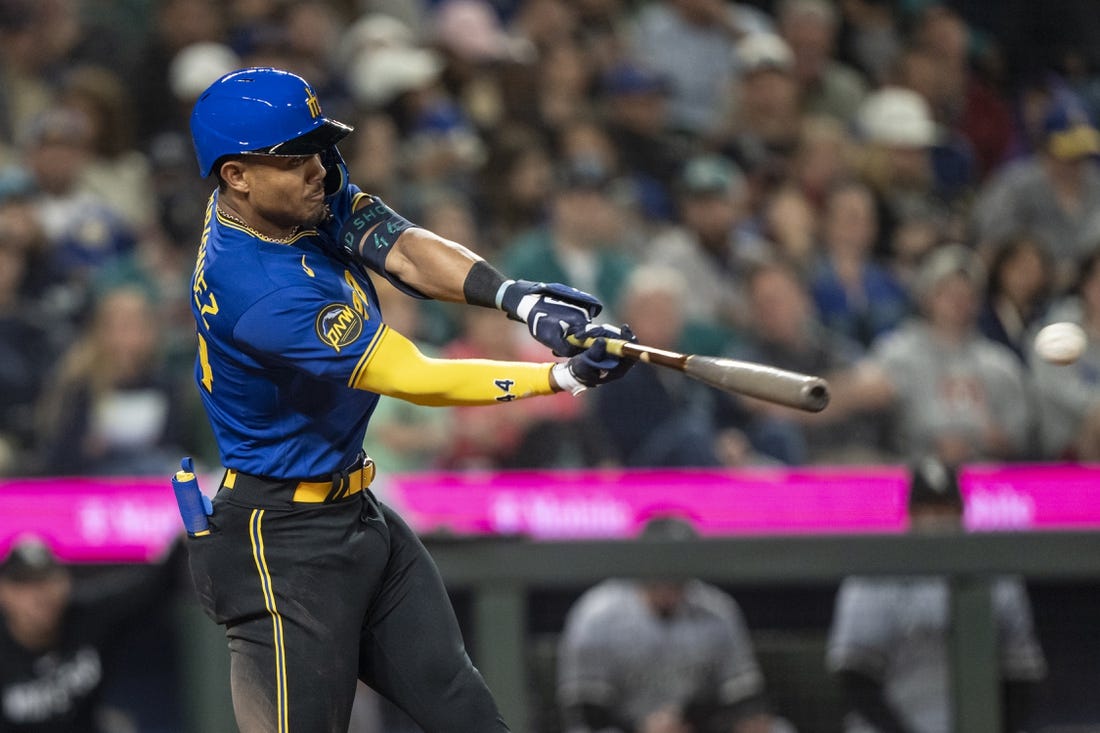 Jun 16, 2023; Seattle, Washington, USA; Seattle Mariners centerfielder Julio Rodriguez (44) hits a double off Chicago White Sox starting pitcher Michael Kopech (34) during the fifth inning at T-Mobile Park. Mandatory Credit: Stephen Brashear-USA TODAY Sports