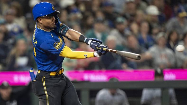 Jun 16, 2023; Seattle, Washington, USA; Seattle Mariners centerfielder Julio Rodriguez (44) hits a double off Chicago White Sox starting pitcher Michael Kopech (34) during the fifth inning at T-Mobile Park. Mandatory Credit: Stephen Brashear-USA TODAY Sports