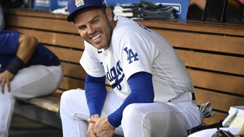 Jun 16, 2023; Los Angeles, California, USA;   Los Angeles Dodgers first baseman Freddie Freeman (5) laughs in the dugout prior to the game against the San Francisco Giants at Dodger Stadium. Mandatory Credit: Jayne Kamin-Oncea-USA TODAY Sports