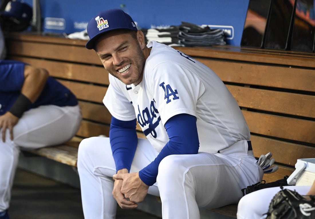 Jun 16, 2023; Los Angeles, California, USA;   Los Angeles Dodgers first baseman Freddie Freeman (5) laughs in the dugout prior to the game against the San Francisco Giants at Dodger Stadium. Mandatory Credit: Jayne Kamin-Oncea-USA TODAY Sports
