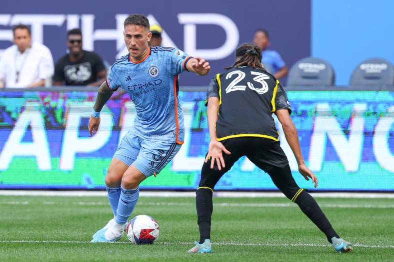 Jun 17, 2023; New York, New York, USA; New York City FC defender Braian Cufre (3) plays the ball against Columbus Crew defender Mohamed Farsi (23) during the first half at Yankee Stadium. Mandatory Credit: Vincent Carchietta-USA TODAY Sports