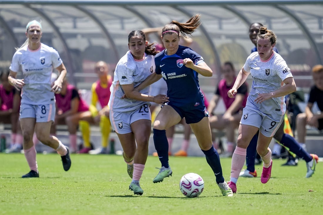 Jun 17, 2023; San Diego, California, USA; San Diego Wave FC defender Abby Dahlkemper (2), Angel City FC midfielder Lily Nabet (28), and Angel City FC midfielder Savannah McCaskill (9) battle for the ball during the first half at Snapdragon Stadium. Mandatory Credit: Ray Acevedo-USA TODAY Sports