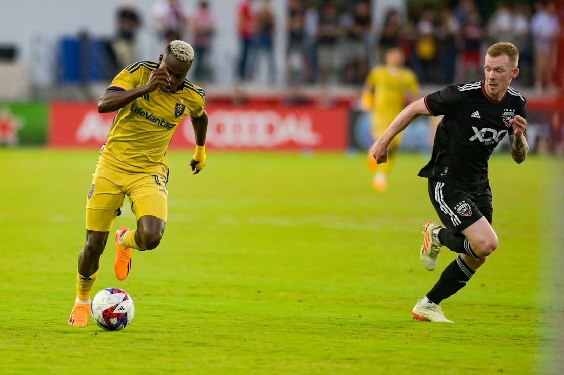 Jun 17, 2023; Washington, District of Columbia, USA; Real Salt Lake forward Carlos Andr s G mez (11) dribbles as h17 defends during the first half  at Audi Field. Mandatory Credit: Tommy Gilligan-USA TODAY Sports