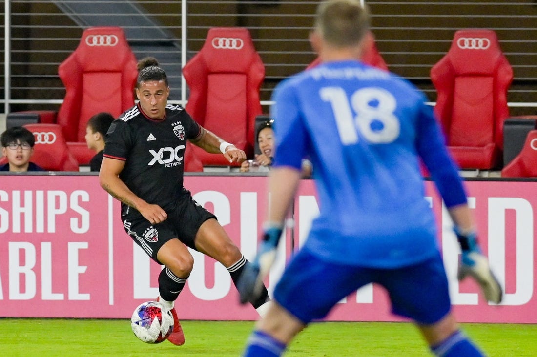 Jun 17, 2023; Washington, District of Columbia, USA; D.C. United forward Erik Hurtado (9)  dribbles as Real Salt Lake goalkeeper Zac MacMath (18) defends during the second  half  at Audi Field. Real Salt Lake defeated D.C. United 2-1.Mandatory Credit: Tommy Gilligan-USA TODAY Sports