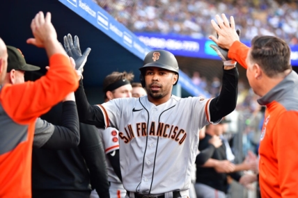 Jun 17, 2023; Los Angeles, California, USA; San Francisco Giants first baseman LaMonte Wade Jr. (31) is greeted after hitting a three run home run against the Los Angeles Dodgers during the fifth inning at Dodger Stadium. Mandatory Credit: Gary A. Vasquez-USA TODAY Sports