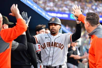 Jun 17, 2023; Los Angeles, California, USA; San Francisco Giants first baseman LaMonte Wade Jr. (31) is greeted after hitting a three run home run against the Los Angeles Dodgers during the fifth inning at Dodger Stadium. Mandatory Credit: Gary A. Vasquez-USA TODAY Sports