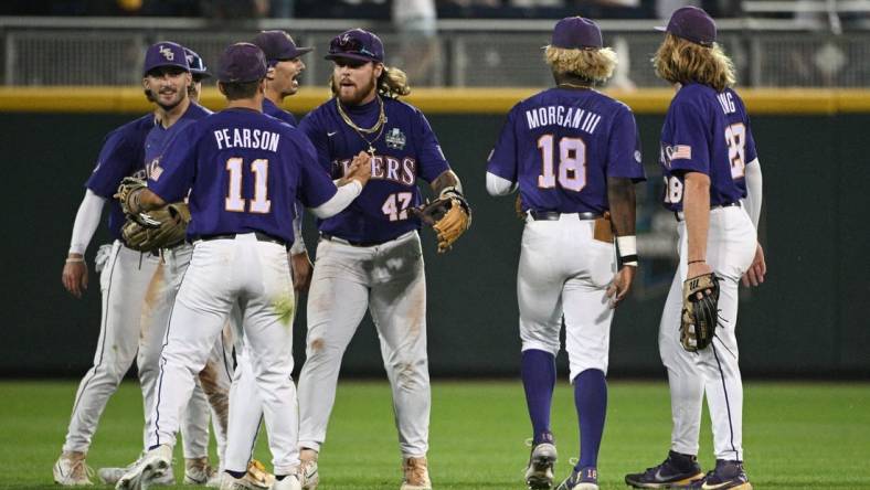 Jun 17, 2023; Omaha, NE, USA; The LSU Tigers celebrate the win against the Tennessee Volunteers at Charles Schwab Field Omaha. Mandatory Credit: Steven Branscombe-USA TODAY Sports