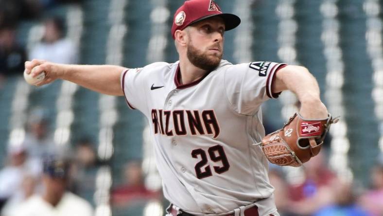 Jun 19, 2023; Milwaukee, Wisconsin, USA; Arizona Diamondbacks pitcher Merrill Kelly (29) pitches against the Milwaukee Brewers in the first inning at American Family Field. Mandatory Credit: Benny Sieu-USA TODAY Sports