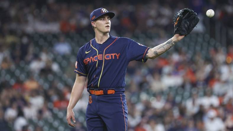 Jun 19, 2023; Houston, Texas, USA; Houston Astros starting pitcher Hunter Brown (58) reacts after a play during the first inning against the New York Mets at Minute Maid Park. Mandatory Credit: Troy Taormina-USA TODAY Sports