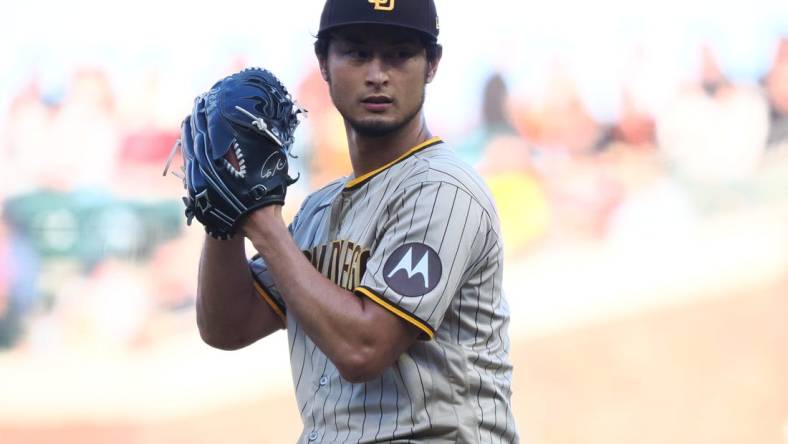 Jun 21, 2023; San Francisco, California, USA;  San Diego Padres starting pitcher Yu Darvish (11) winds up for a pitch against the San Francisco Giants during the first inning at Oracle Park. Mandatory Credit: Kelley L Cox-USA TODAY Sports