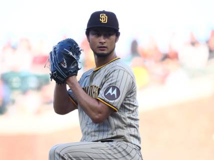 Jun 21, 2023; San Francisco, California, USA;  San Diego Padres starting pitcher Yu Darvish (11) winds up for a pitch against the San Francisco Giants during the first inning at Oracle Park. Mandatory Credit: Kelley L Cox-USA TODAY Sports