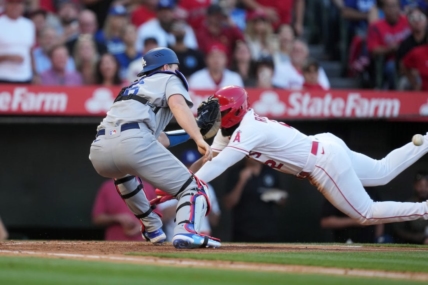 Jun 21, 2023; Anaheim, California, USA; Los Angeles Angels third baseman Luis Rengifo (2) is tagged out at home plate by Los Angeles Dodgers catcher Will Smith (16) in the third inning at Angel Stadium. Mandatory Credit: Kirby Lee-USA TODAY Sports