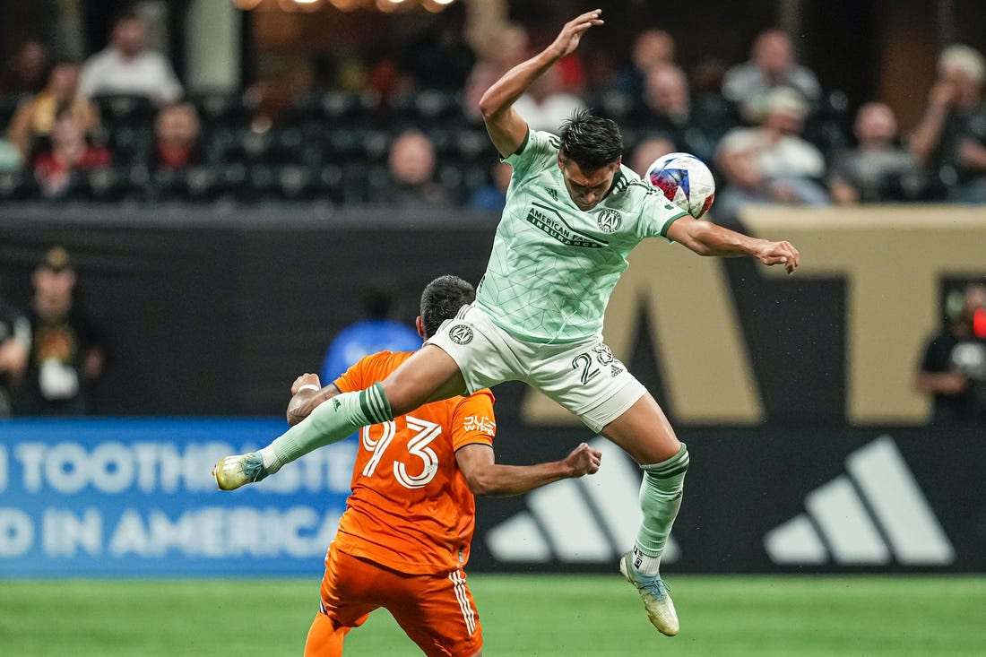 Jun 21, 2023; Atlanta, Georgia, USA; Atlanta United forward Tyler Wolff (28) plays the ball over top of New York City FC defender Tony Alfaro (93) during the second half at Mercedes-Benz Stadium. Mandatory Credit: Dale Zanine-USA TODAY Sports