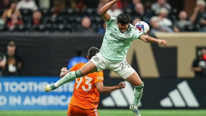 Jun 21, 2023; Atlanta, Georgia, USA; Atlanta United forward Tyler Wolff (28) plays the ball over top of New York City FC defender Tony Alfaro (93) during the second half at Mercedes-Benz Stadium. Mandatory Credit: Dale Zanine-USA TODAY Sports