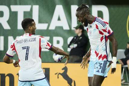 Jun 21, 2023; Portland, Oregon, USA; Chicago Fire forward Kei Kamara (23) celebrates with midfielder Maren Haile-Selassie (7) after scoring a goal in the second half against the Portland Timbers at Providence Park. Mandatory Credit: Troy Wayrynen-USA TODAY Sports